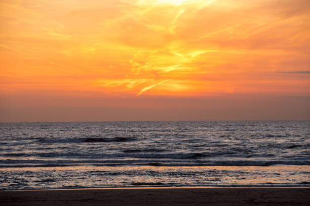 Scenic View Of Sea Against Orange Sky