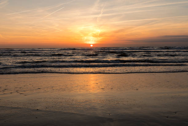 Scenic View Of Sea Against Orange Sky