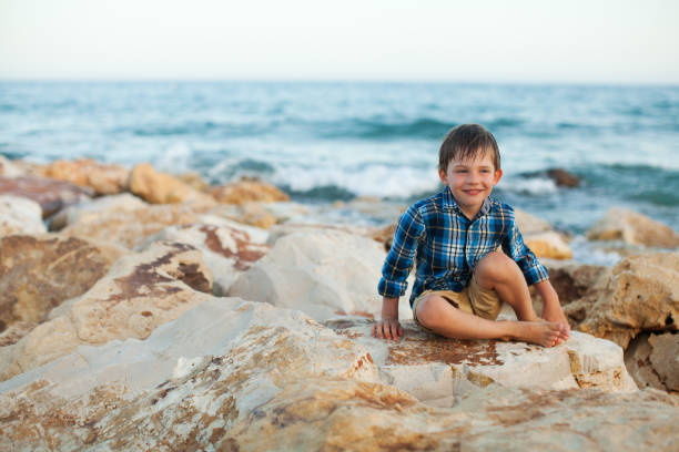 istock Little boy at the beach 947241444