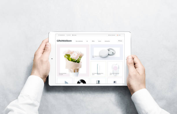 Hands holding tablet with gifts webstore mock up on screen