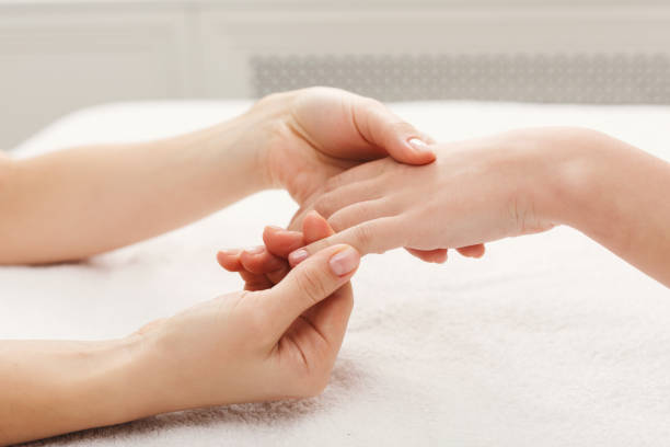 istock Hand massage at spa salon on white towel 947246174