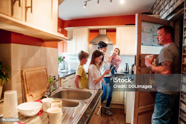 Family Life In The Kitchen Stock Photo - Download Image Now - Crowded, Family, Domestic Life