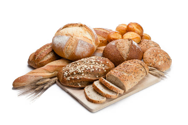 istock Loaves of bread heap shot on white background 947253722