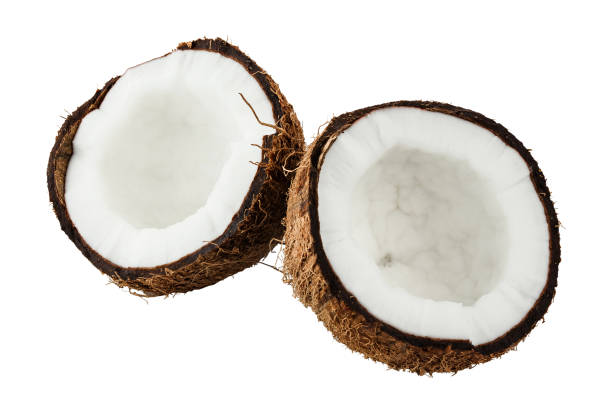 istock two halves of coconut isolated on white background, exotic nut 947260538