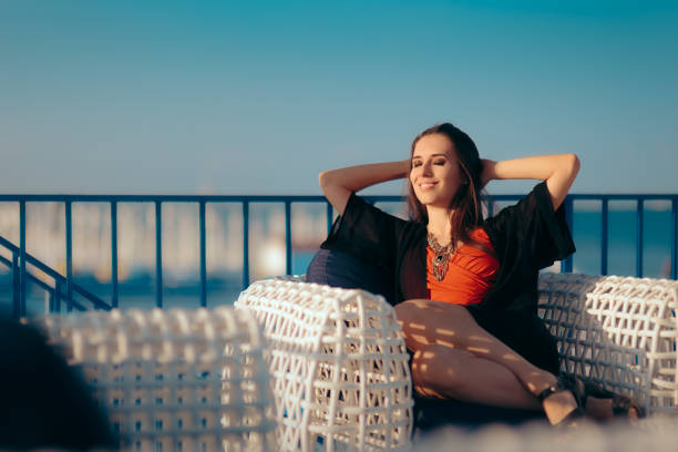 Beautiful girl enjoying tranquil moment at the beach