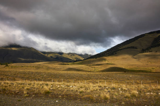 Rural scenery. Colorful mountains, plantations and a country road.