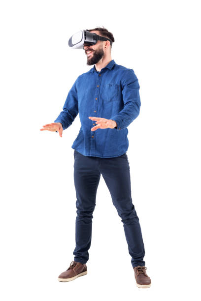 istock Excited young business man watching vr glasses laughing and gesturing with hands. 947279036