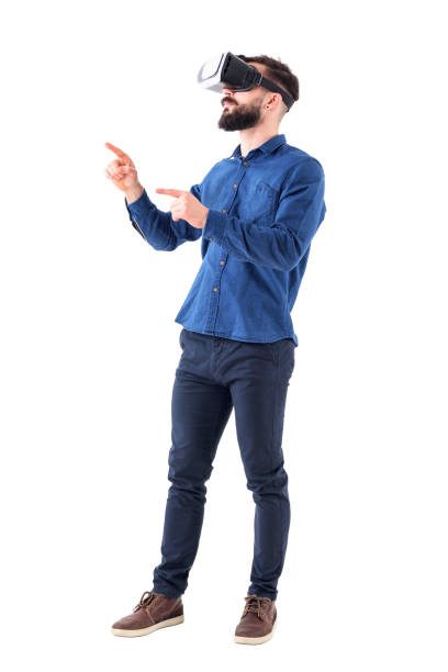 istock Side view of bearded business man gesticulating with hand and finger having virtual reality experience 947279418