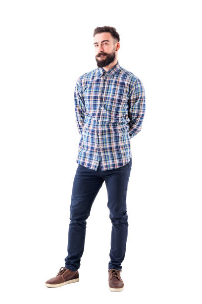 istock Uncertain skeptical bearded young adult man judging and looking at camera 947279688