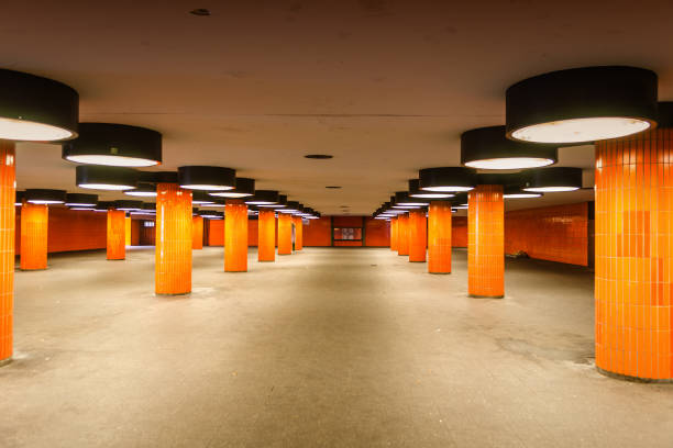 istock futuristic undercrossing with round lamps and orange columns 947286496