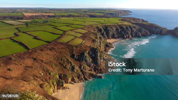Overhead Aerial View Of The Sandy Beach And Cove Of Porthcurno On The Southwest Coast Of Cornwall England Stock Photo - Download Image Now