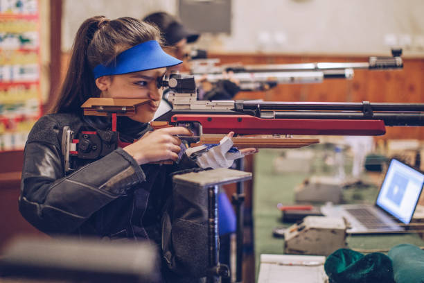 istock Girls on rifle shooting training 947290568