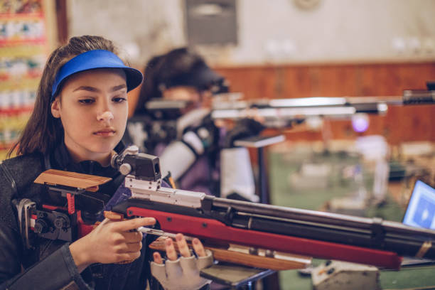istock Women on rifle shooting training 947291204