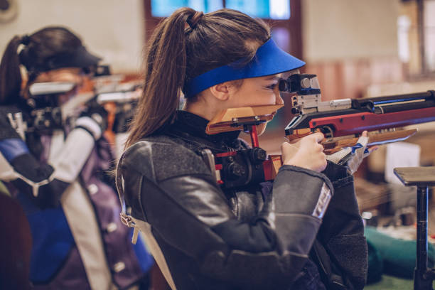 istock Women on rifle shooting practice 947291478