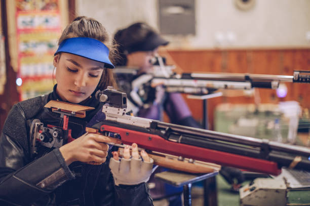 istock Women training rifle shooting 947291858