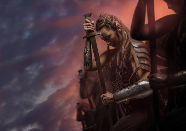 Beautiful female warrior elf with sword over cloudy sky