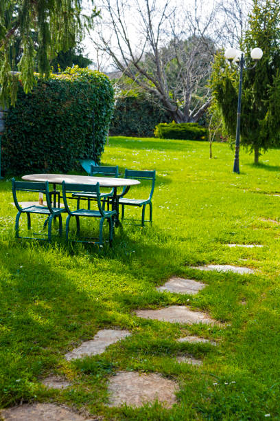 Old iron furniture in garden at springtime