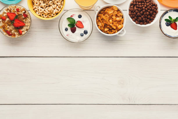 istock Healthy breakfast meals on wooden table copy space 947295492