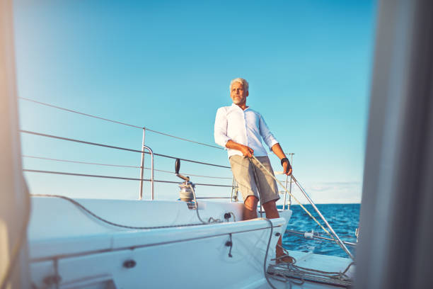 istock Mature man out for a sail on his boat 947295722