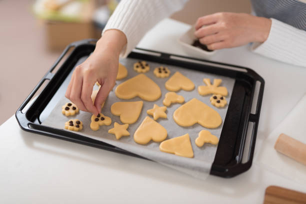 istock Closeup of hand putting chocolate on pastry 947299206
