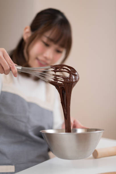 istock Woman making chocolate pastry in kitchen 947299584