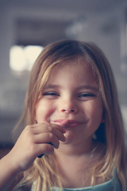 istock Little girl make her up. 947300048