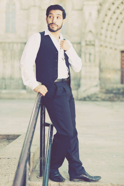istock Confident man posing near iron banisters 947300312
