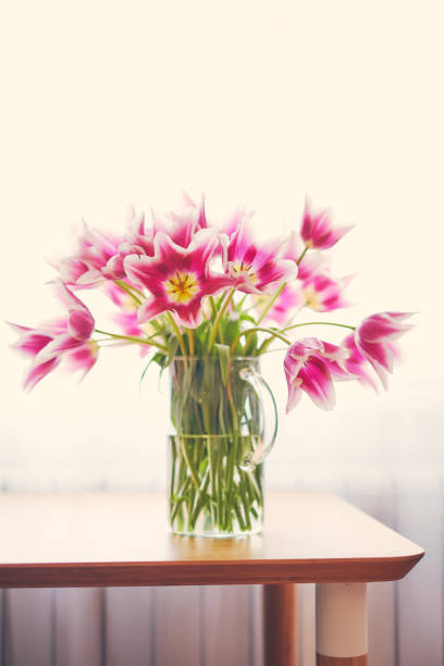 istock Pink tulips in a vase 947303852