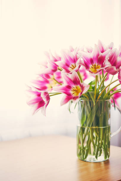 istock Pink tulips in a vase 947303880