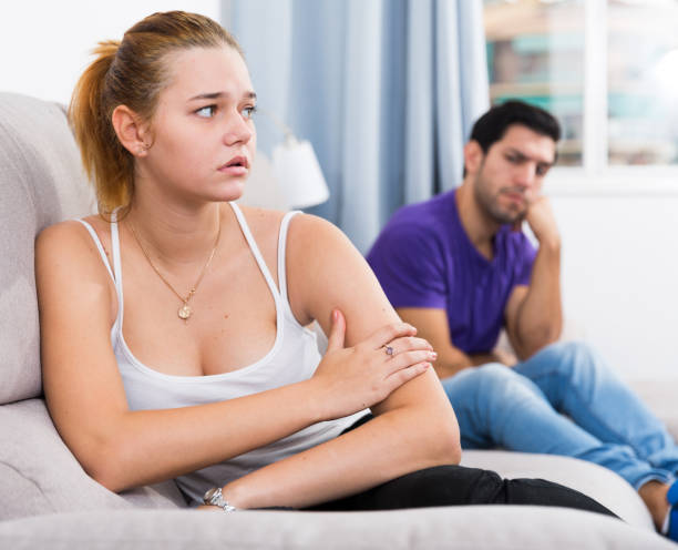 istock Woman on sofa after quarrel with husband 947304020