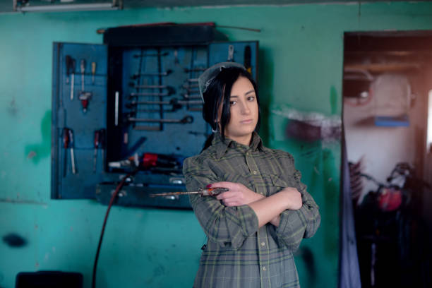 istock Young woman in front of the tool box 947315886