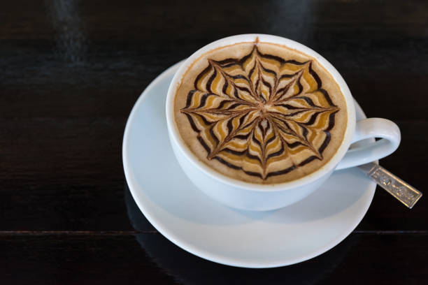 istock Latte art coffee cup  on black wooden table 947319102