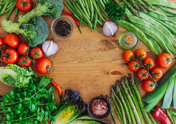 istock Fresh organic vegetables on a wooden background 947319122