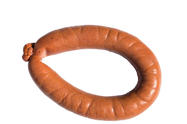 istock Smoked sausage isolated on white background 947319356