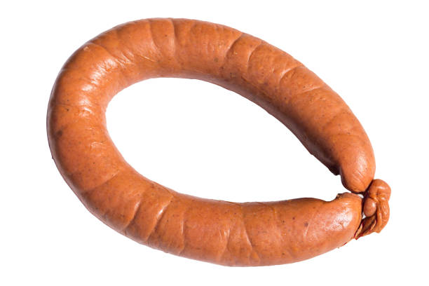 istock Smoked sausage isolated on white background 947319366