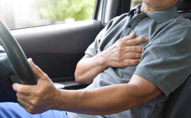 Asian Senior man having heart attack.