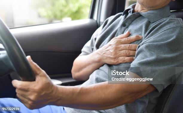 Asian Senior Man Having Heart Attack Stock Photo - Download Image Now - Driving, Illness, Heart Attack