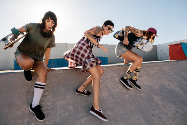istock Female skaters having fun at skate park 947323572