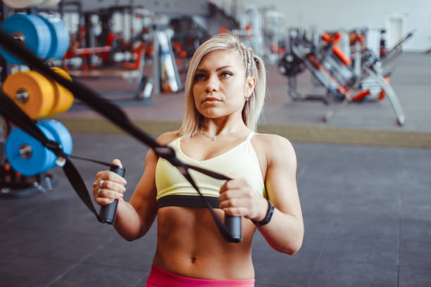 istock girl doing exercises with ropes 947323658