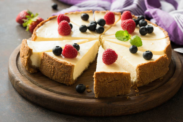 Summer berry cheesecake cut into slices Summer berry cheesecake cut into slices. Selective focus torte photos stock pictures, royalty-free photos & images