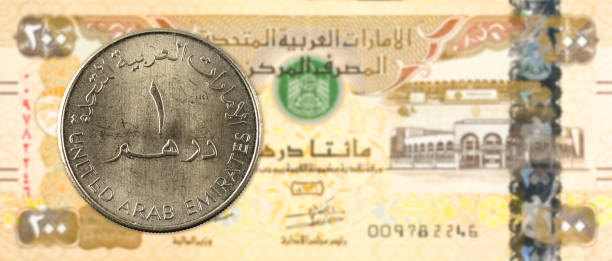 istock 1 dirham coin against 200 united arab emirates dirham bank note obverse 947330416