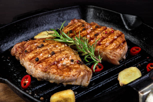 istock Grilled pork steak in grill pan 947330564