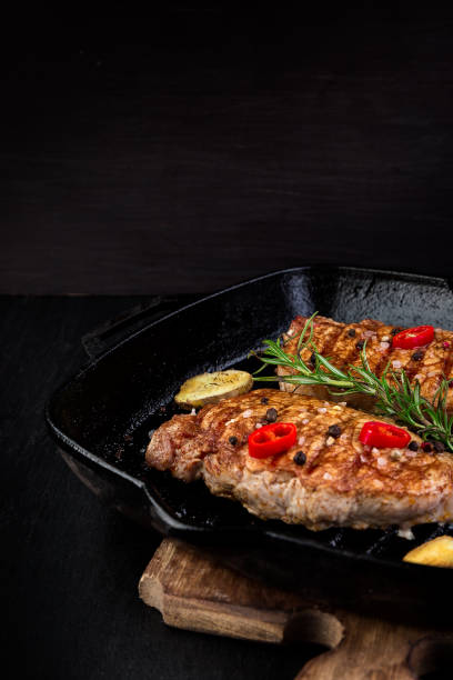 istock Grilled pork steak in grill pan 947330584