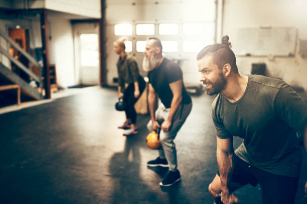 istock Fit people working out with dumbbells during a gym class 947331538