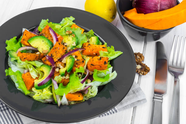 istock Delicious salad with avocado, pumpkin, greens 947335544