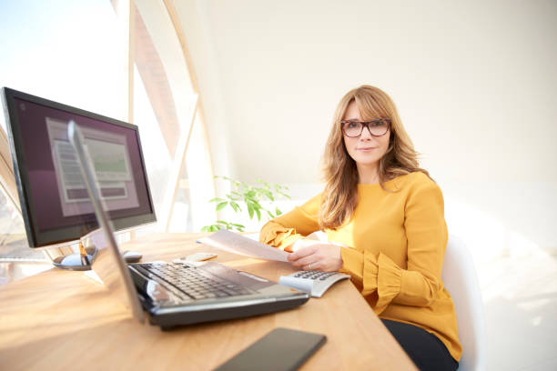 istock Smiling businesswoman working from home 947335758