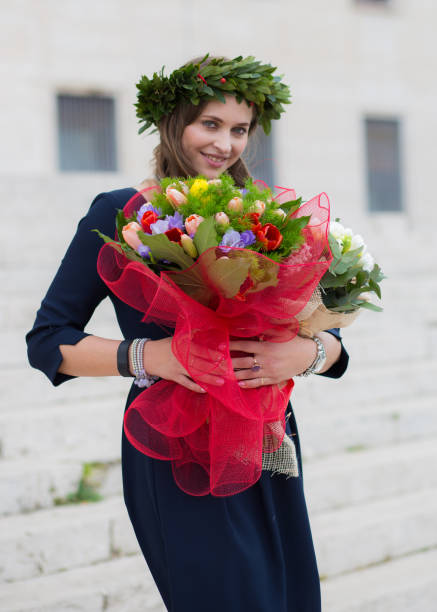 beautiful smily girl this flowers graduated