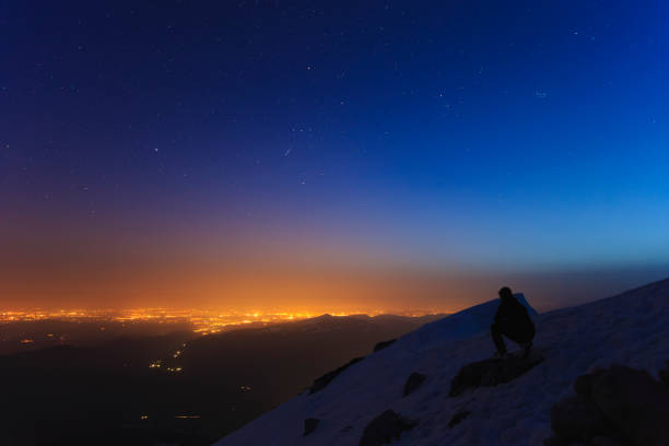 istock Snow covered mountain under the star lit sky 947339458