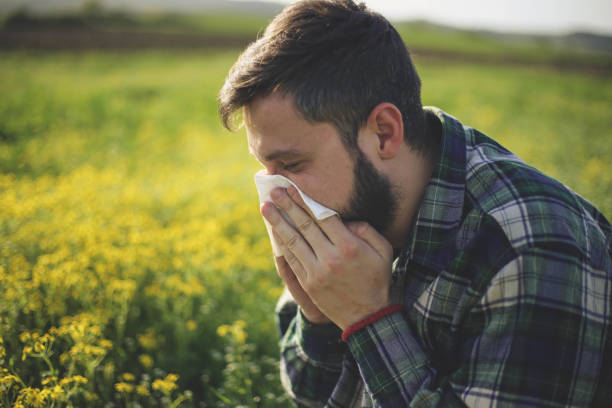 Hipster man Sneezing Hipster man Sneezing hayfever stock pictures, royalty-free photos & images