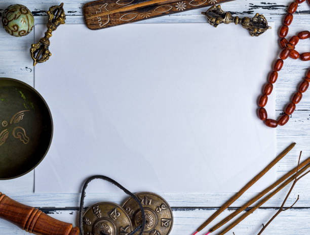 istock Copper singing bowl, prayer beads, prayer drum, stone balls and other Tibetan religious objects for meditation 947340828